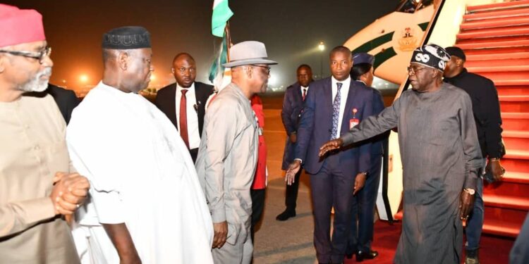 Tinubu returns from France, amidst protest on rising food and living costs